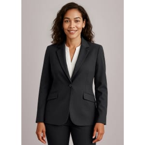 A women's longline jacket in black, featuring a tailored fit, lapel collar, and pockets. The model is smiling.