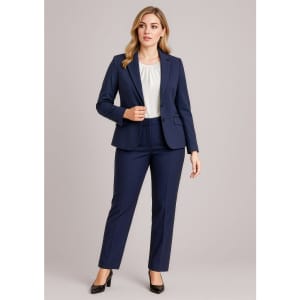 A navy mid-length jacket paired with matching tailored trousers, featuring a white blouse and black heels.