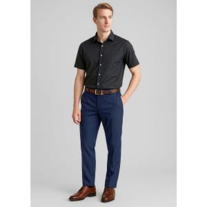 Men's comfort wool stretch slimline pant in navy blue, paired with a black shirt and brown belt. Features a logo.