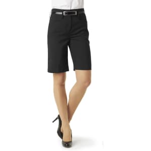 A pair of black dress shorts with a fitted design and a belt, modelled on a person wearing heeled shoes.