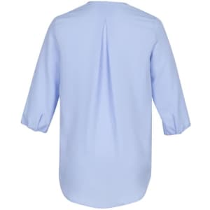 A light blue women's longline blouse featuring a back pleat and three-quarter sleeves. It has a logo visible.