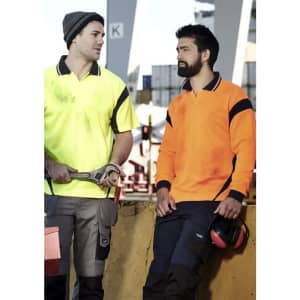 Two men wearing high visibility polo shirts in yellow and orange, with workwear trousers and safety gear.