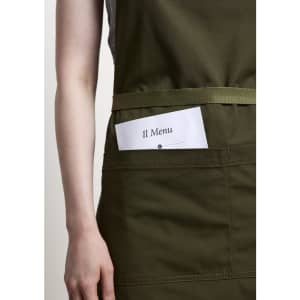 A green apron featuring a front pocket holding a menu card, with a simple logo.
