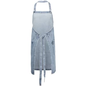 A blue denim apron features an open front, adjustable straps, and side pockets, with a logo on it.
