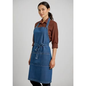 A denim apron in blue with adjustable straps and pockets, worn over a brown long-sleeve shirt.