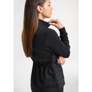 A women's black tailor jacket with a cinched waist, featuring a sleek design and a logo on the back.