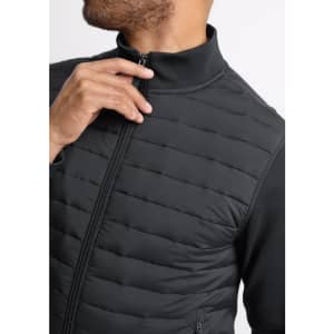 A men's tailor jacket in black with a zip front and a high collar, featuring quilted texture.