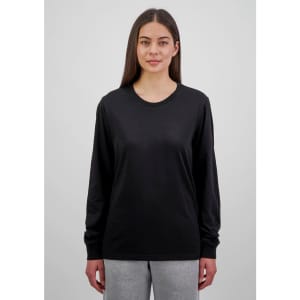 A black long sleeve women's t-shirt displayed on a model, featuring a simple design and a logo.