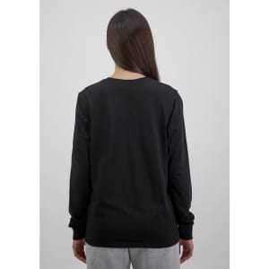 A black long sleeve women's tee, showing the back view and paired with light grey pants. The shirt has a logo.