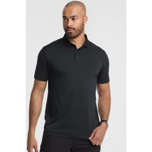 A men's short sleeve polo in black, featuring a collar and a logo. Model is posing.