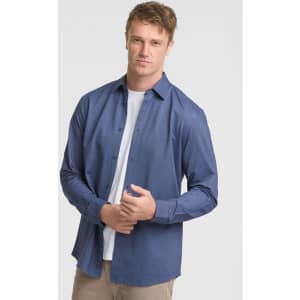 A long sleeve men's shirt in navy blue, featuring a button-up design and a branded logo.