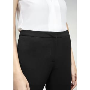 Black women's slacks feature a sleek design, shown with a light-coloured shirt. The waistband is smooth and tailored.