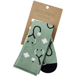 A pair of mint green unisex socks featuring a medical stethoscope pattern and a logo on the packaging.