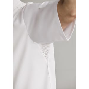 A white short sleeve chef jacket featuring mesh underarm panels and a logo.
