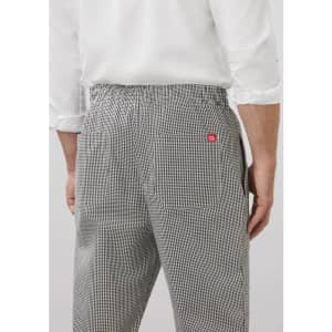A pair of mens track pants in a black and white checkered pattern, featuring a waistband and pockets on the back.