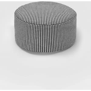 A round ottoman in a black and white checkered pattern, featuring a soft, upholstered exterior.