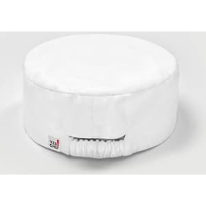 A white chef cap with a round shape and an elastic band at the back. It features a small logo tag.