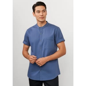 A short sleeve chef shirt in a deep blue colour, featuring a button-up front and a chest pocket.