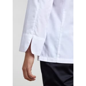 A white long sleeve chef jacket featuring split cuffs and a sleek design. It has branding on the fabric.