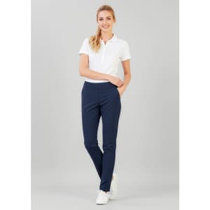 A pair of women's navy stretch pants with a slim fit, paired with a white polo shirt and white sneakers.