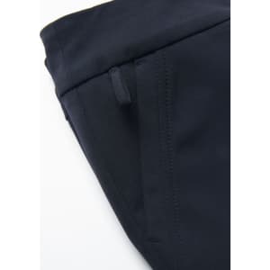 A close-up of a navy women's stretch pant featuring side pockets and a smooth fabric finish.