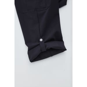 A pair of navy women's cargo pants featuring a rolled cuff and button detail.