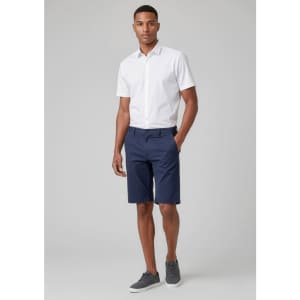 Men's comfort waist cargo shorts in navy, paired with a white short-sleeve shirt and grey shoes. Logo present.