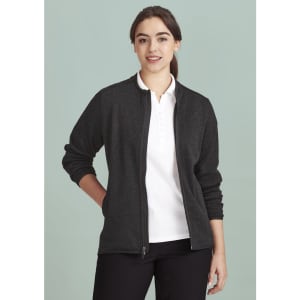A women's zip front jumper in black polar fleece, featuring a standard collar and long sleeves. The model wears a white polo shirt underneath.