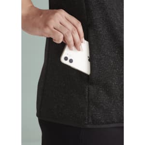 A black jumpers with a side pocket, showing a hand placing a phone inside. Features a sleek design and soft fabric.