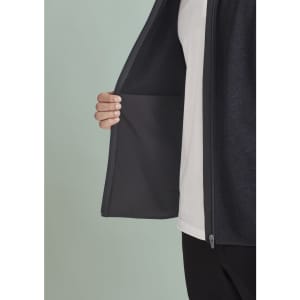 A men's zip front vest in dark fabric, featuring a hidden pocket inside the open front.