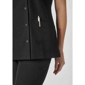 A black women's jacket featuring a pocket with a clip pen. The fabric has a sleek design with buttons.