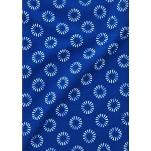 A blue fabric featuring a floral daisy print in white, suitable for a short sleeve shirt.