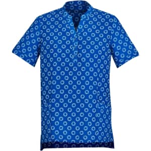 A blue tunic featuring a white daisy print, with short sleeves and a collarless neckline, designed as a women's uniform.