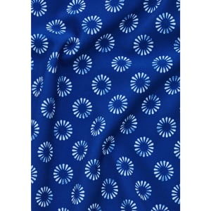 A blue tunic fabric featuring a white daisy print pattern. The material appears smooth and has a draping quality.