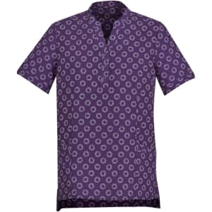 A purple tunic featuring a daisy print pattern, designed as part of a uniform collection.