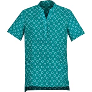A women's tunic in teal with a white daisy print, featuring a short collar and short sleeves. It has a logo.