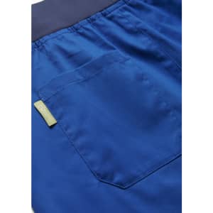 A close-up of blue women's jogger scrub pants featuring a back pocket and waistband. Includes a logo tag.