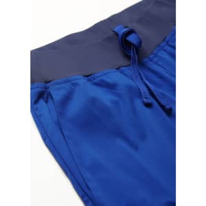 A close-up of blue jogger scrub pants featuring a navy waistband and drawstring.