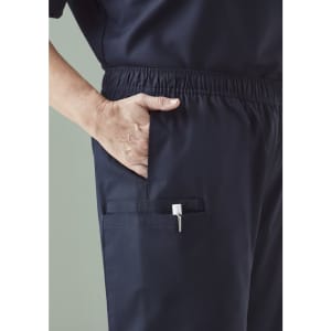 A pair of men's scrub pants in navy with an elastic waistband and multiple pockets. Features a logo.