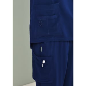 Navy blue women's scrub pants featuring multiple pockets and a loop for attachments.