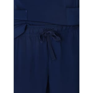 Navy blue women's straight leg scrub pants featuring a drawstring waist and pockets. Branding is present on the fabric.
