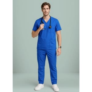 A man wearing a blue V-neck scrub top and matching trousers, holding a stethoscope, with a logo visible.