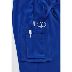A pair of royal blue straight leg scrub pants featuring a large pocket with scissors and a pen.