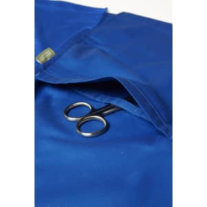 A blue women's scrub top with a pocket containing a pair of scissors and featuring a logo.