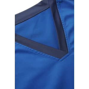 A close-up of a blue scrub top featuring a V-neckline with a contrasting dark blue trim.