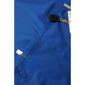 A blue men's scrub top featuring a badge holder and a security reel. The fabric has a smooth texture.