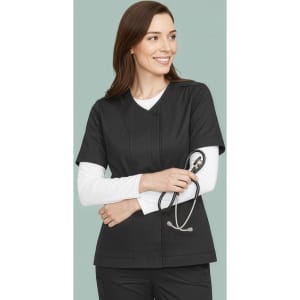 A women's black zip front crossover scrub top with a v-neckline. Includes a logo and features a model holding a stethoscope.