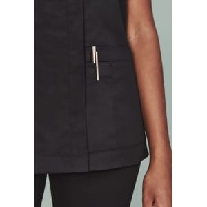 Black women's scrub top featuring a zip front and a side pocket with a pen holder.