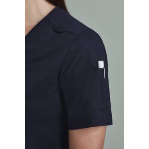 A navy women's zip front crossover scrub top featuring short sleeves and a pocket on the sleeve.