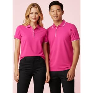 A pink short sleeve polo shirt featuring a contrasting trim, displayed on models in a neutral background.